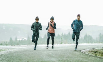 Group of runners running in the snow